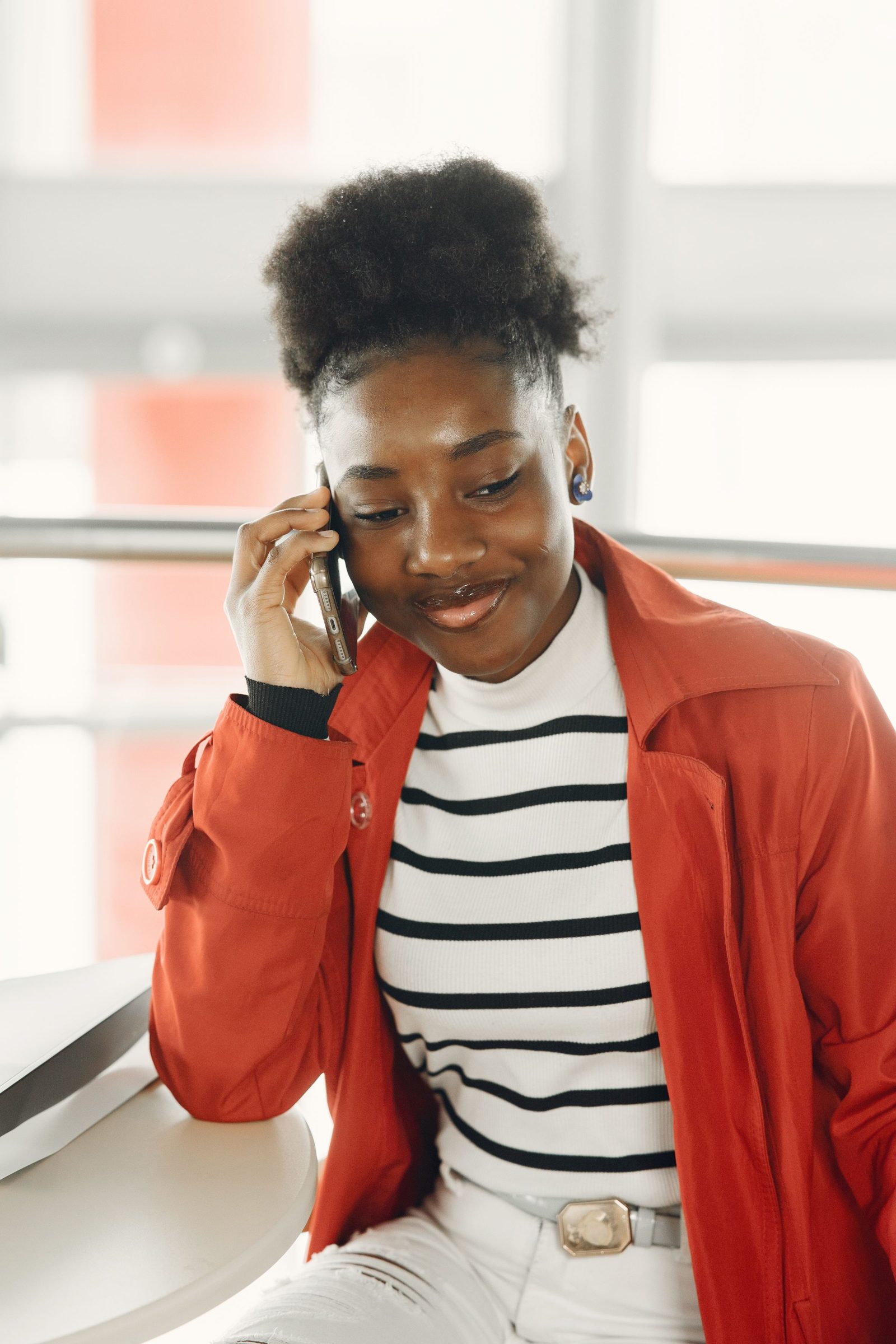 A woman smiling on a phone call